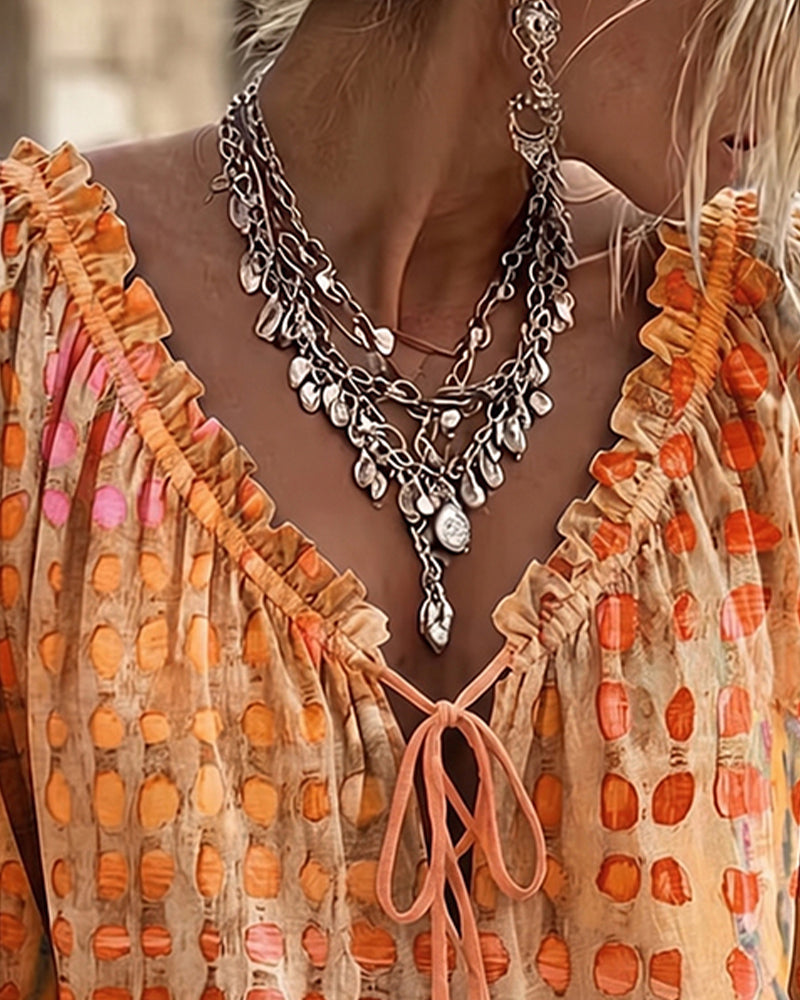 Lena | Blouse met stippenpatroon en vetersluiting