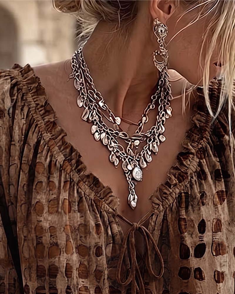 Lena | Blouse met stippenpatroon en vetersluiting