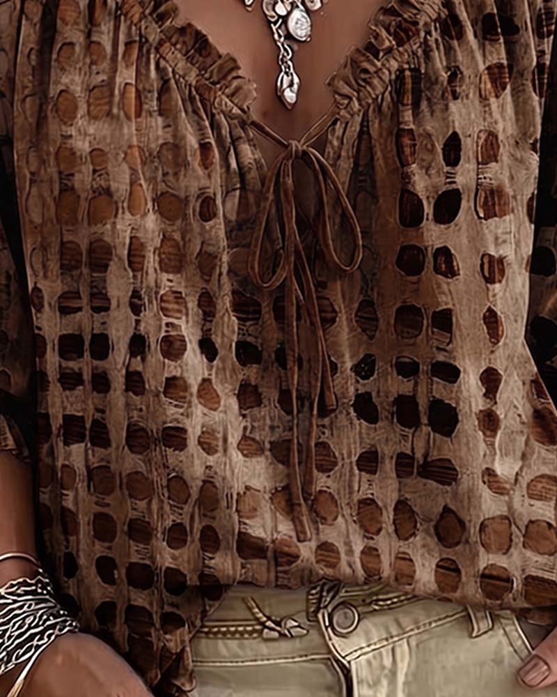 Lena | Blouse met stippenpatroon en vetersluiting